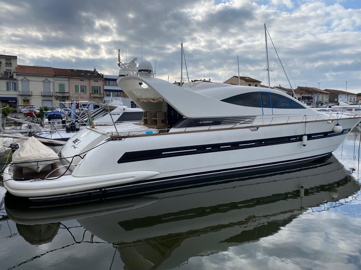a boat docked in a harbor aboard DEA Yacht for Sale