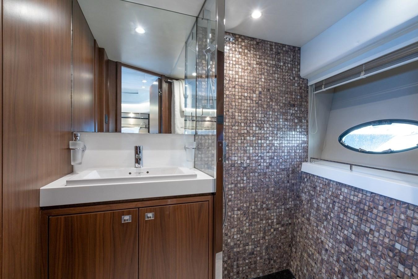 a bathroom with a sink and a mirror aboard SOL INVICTUS Yacht for Sale