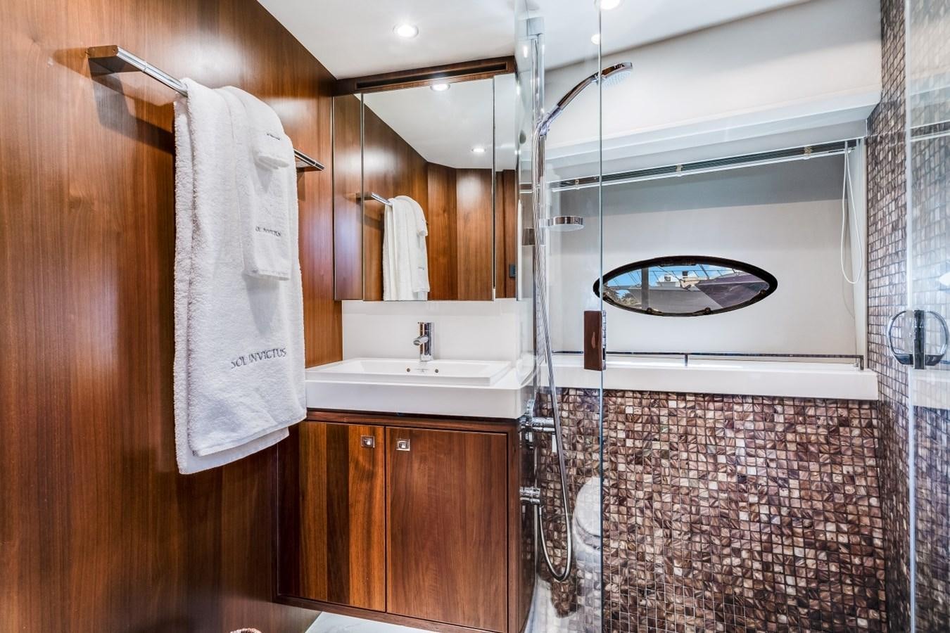 a bathroom with a sink and a shower unit aboard SOL INVICTUS Yacht for Sale
