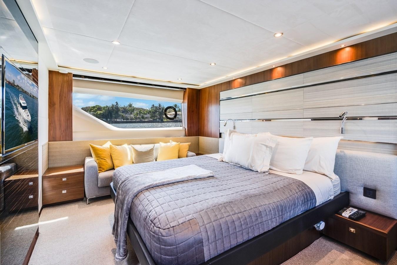 a room with a bed and a television aboard SOL INVICTUS Yacht for Sale