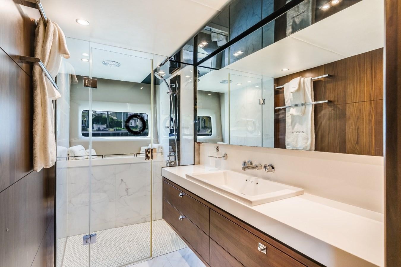 a bathroom with a large mirror aboard SOL INVICTUS Yacht for Sale