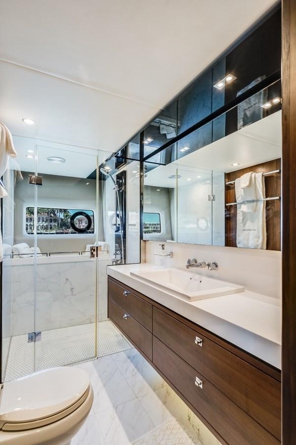 a bathroom with a large mirror aboard SOL INVICTUS Yacht for Sale