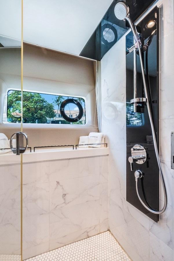 a bathroom with a shower unit aboard SOL INVICTUS Yacht for Sale