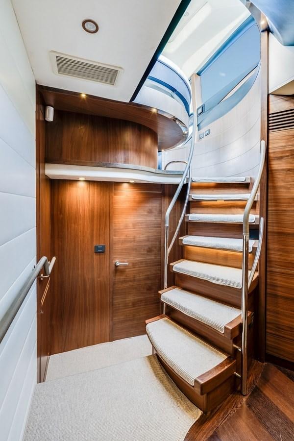 a wooden staircase in a room aboard SOL INVICTUS Yacht for Sale