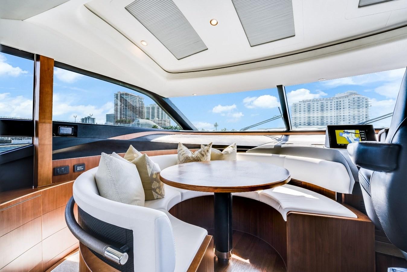 a room with a table and chairs aboard SOL INVICTUS Yacht for Sale