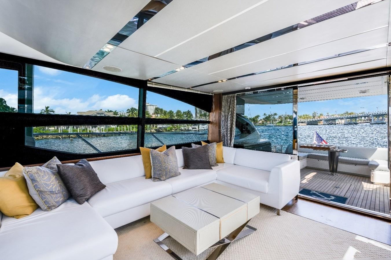 a living room with a large window aboard SOL INVICTUS Yacht for Sale