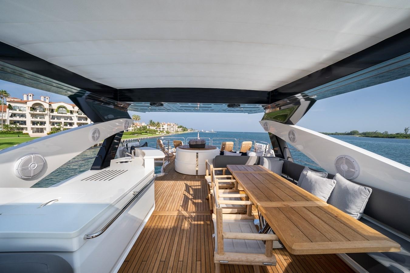 a deck with a view of the water and boats aboard 2015 SUNSEEKER 92' Yacht for Sale