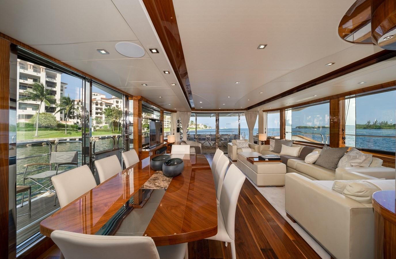 a living room with a large window aboard 2015 SUNSEEKER 92' Yacht for Sale