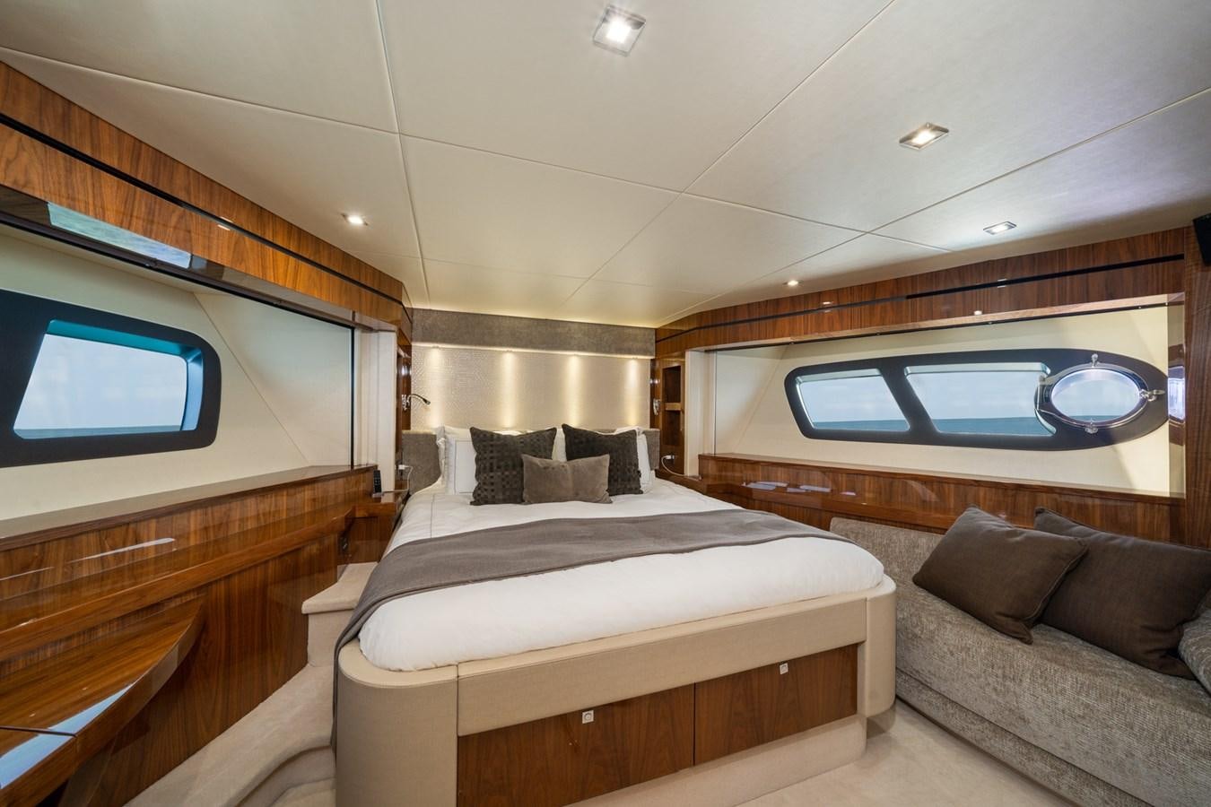 a room with a bed and a couch aboard 2015 SUNSEEKER 92' Yacht for Sale