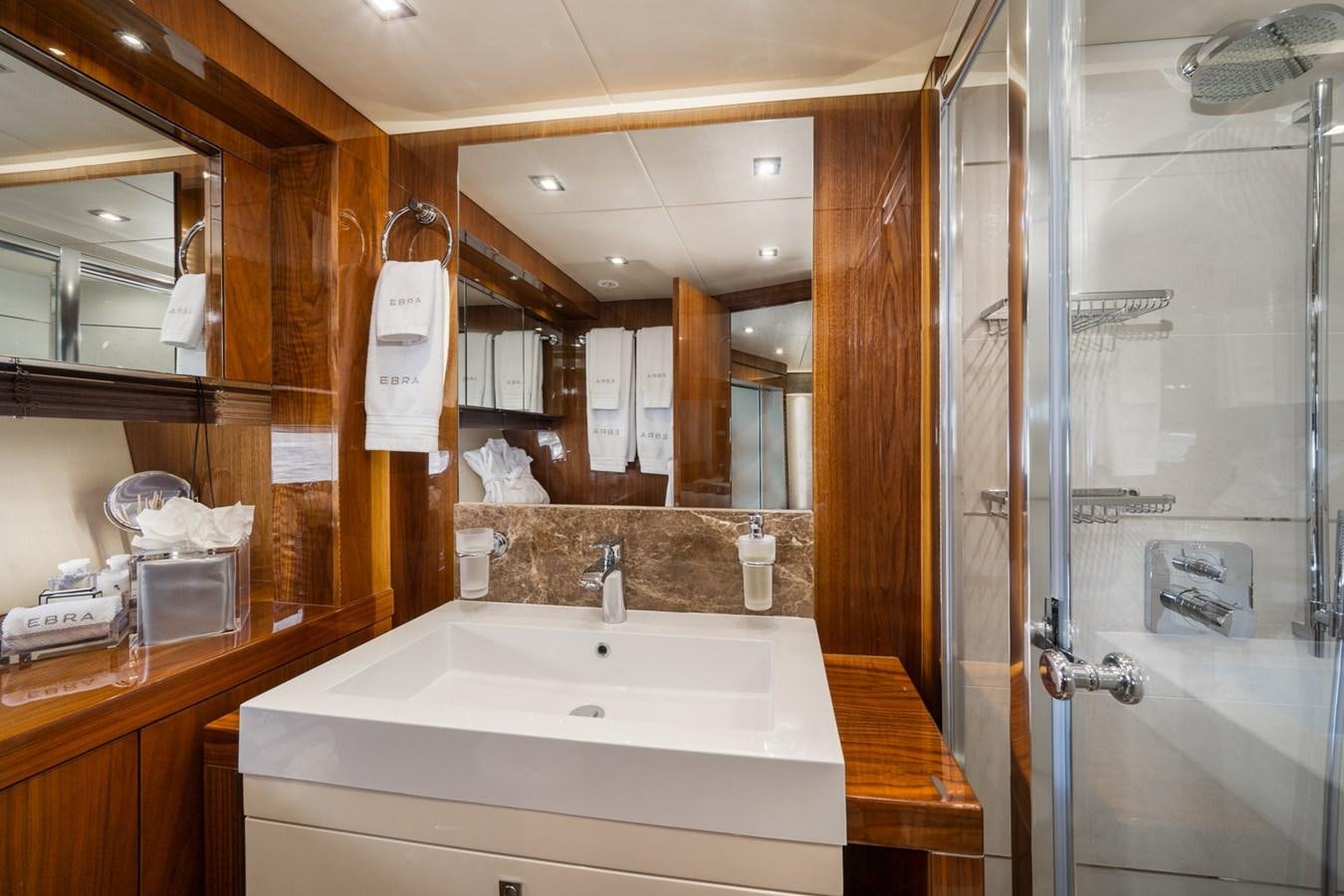 a bathroom with a glass shower aboard 2015 SUNSEEKER 92' Yacht for Sale