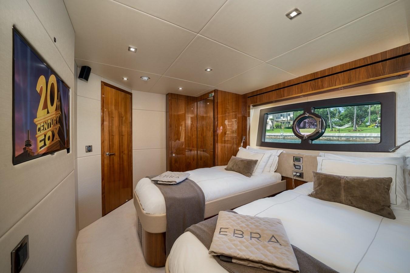a room with two beds aboard 2015 SUNSEEKER 92' Yacht for Sale