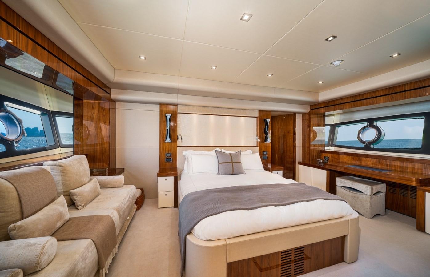 a room with a bed and a couch aboard 2015 SUNSEEKER 92' Yacht for Sale