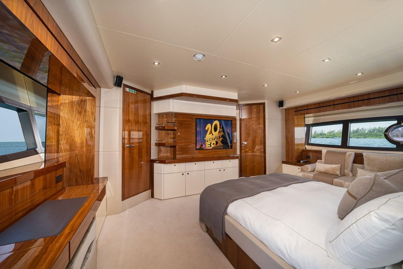 a room with a bed and a tv aboard 2015 SUNSEEKER 92' Yacht for Sale