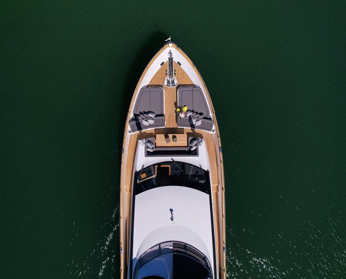 a white and gold boat on water aboard 2015 SUNSEEKER 92' Yacht for Sale