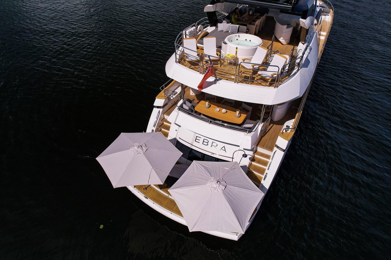 a boat with umbrellas on it aboard 2015 SUNSEEKER 92' Yacht for Sale