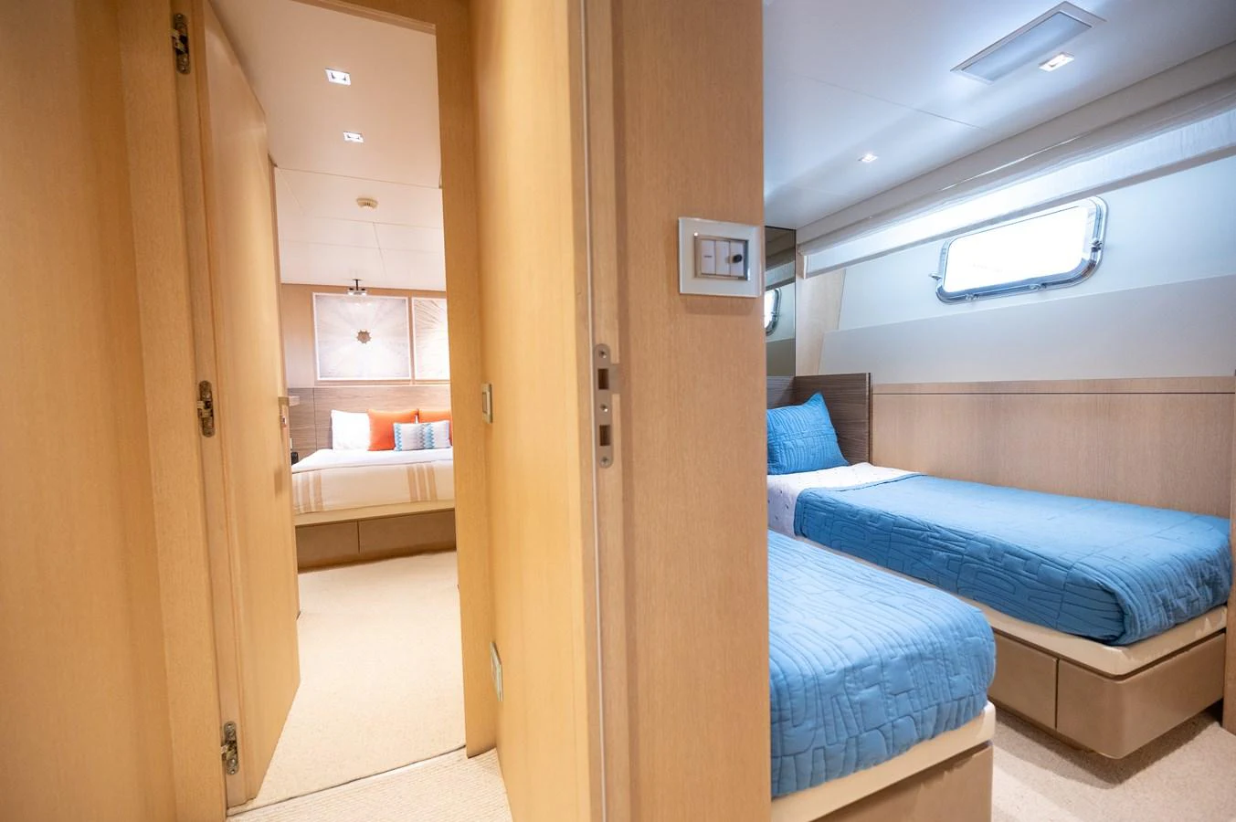 a room with a bed and a closet aboard ASTONISH Yacht for Sale
