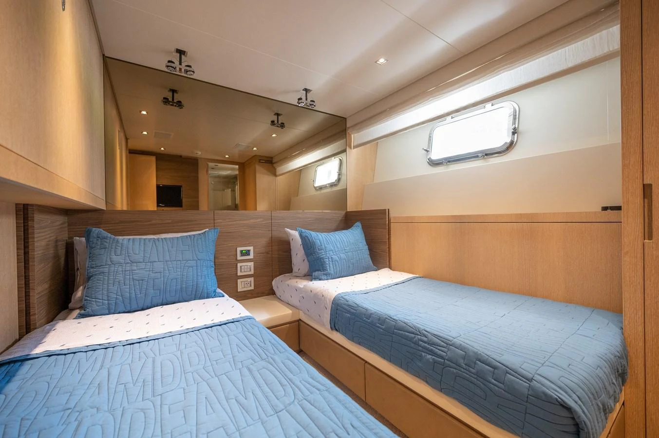 a couple of beds in a hotel room aboard ASTONISH Yacht for Sale