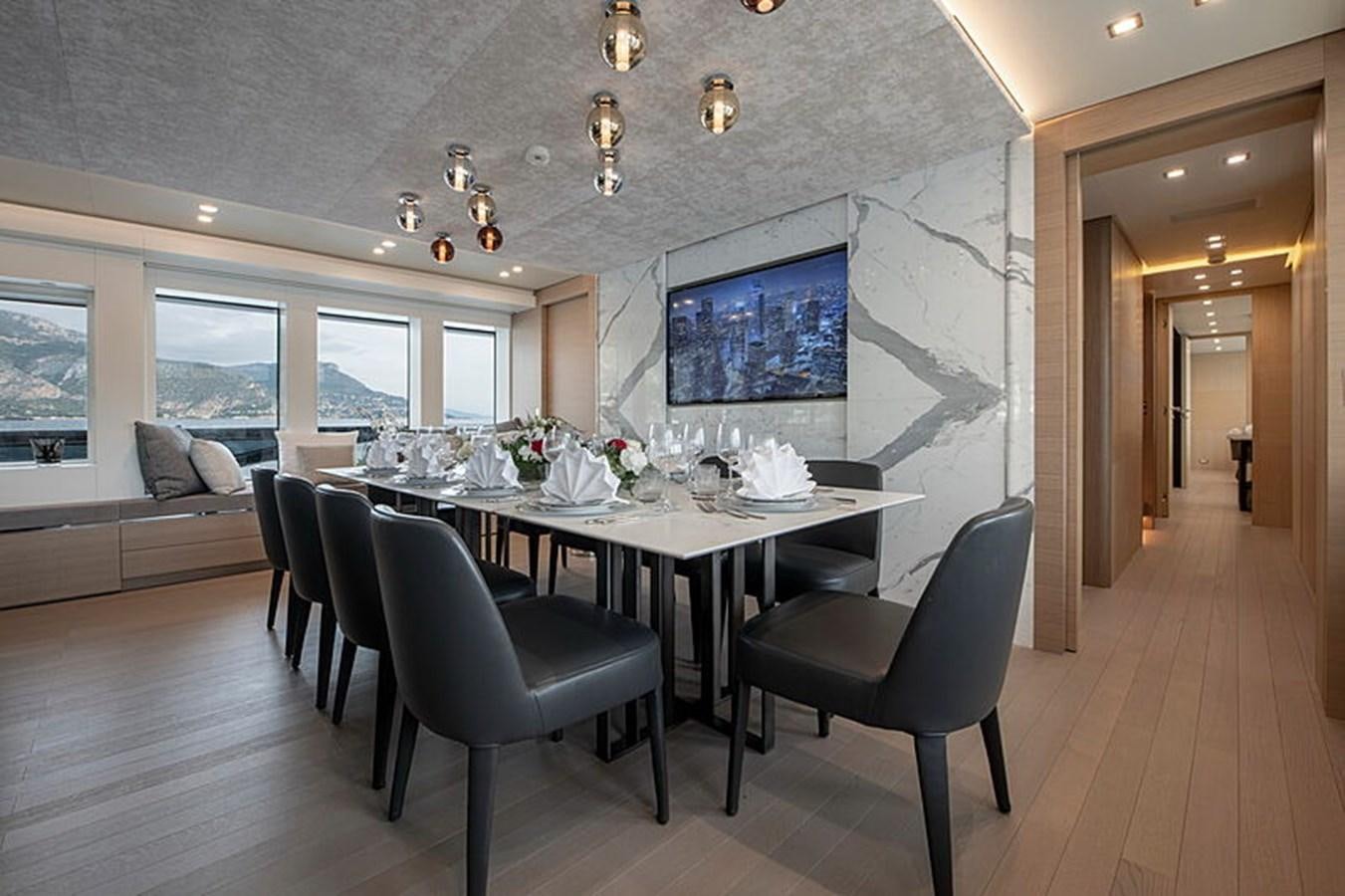 a large dining room with a large table and chairs aboard NEXT Yacht for Sale