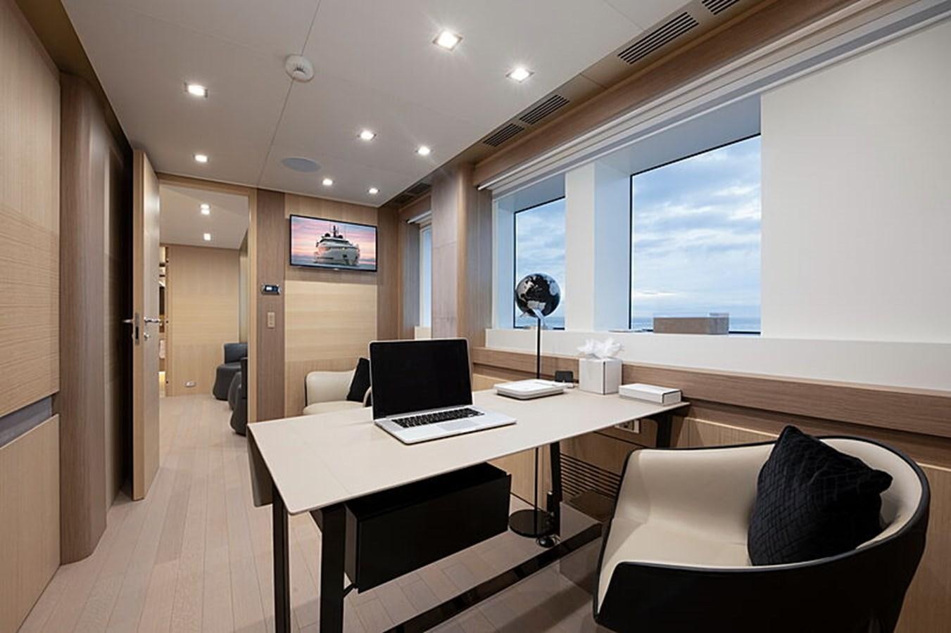 a room with a table and chairs aboard NEXT Yacht for Sale