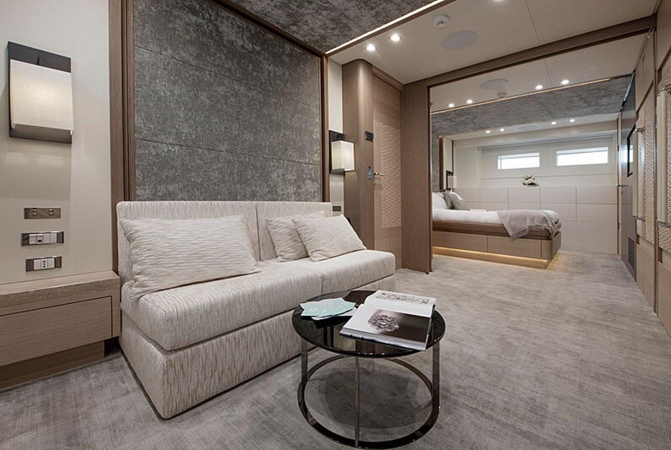 a living room with a couch and a table aboard NEXT Yacht for Sale