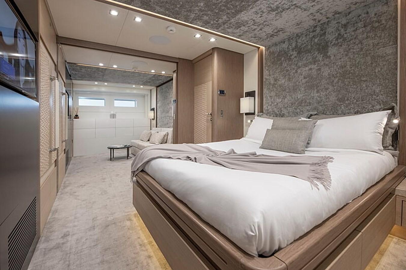 a bedroom with a large bed aboard NEXT Yacht for Sale