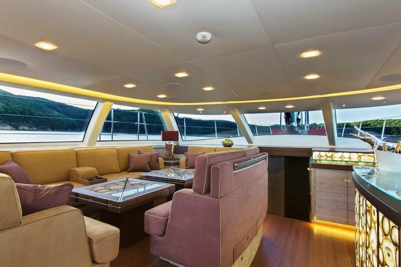 a living room with a large glass window aboard ESCAPADE Yacht for Sale