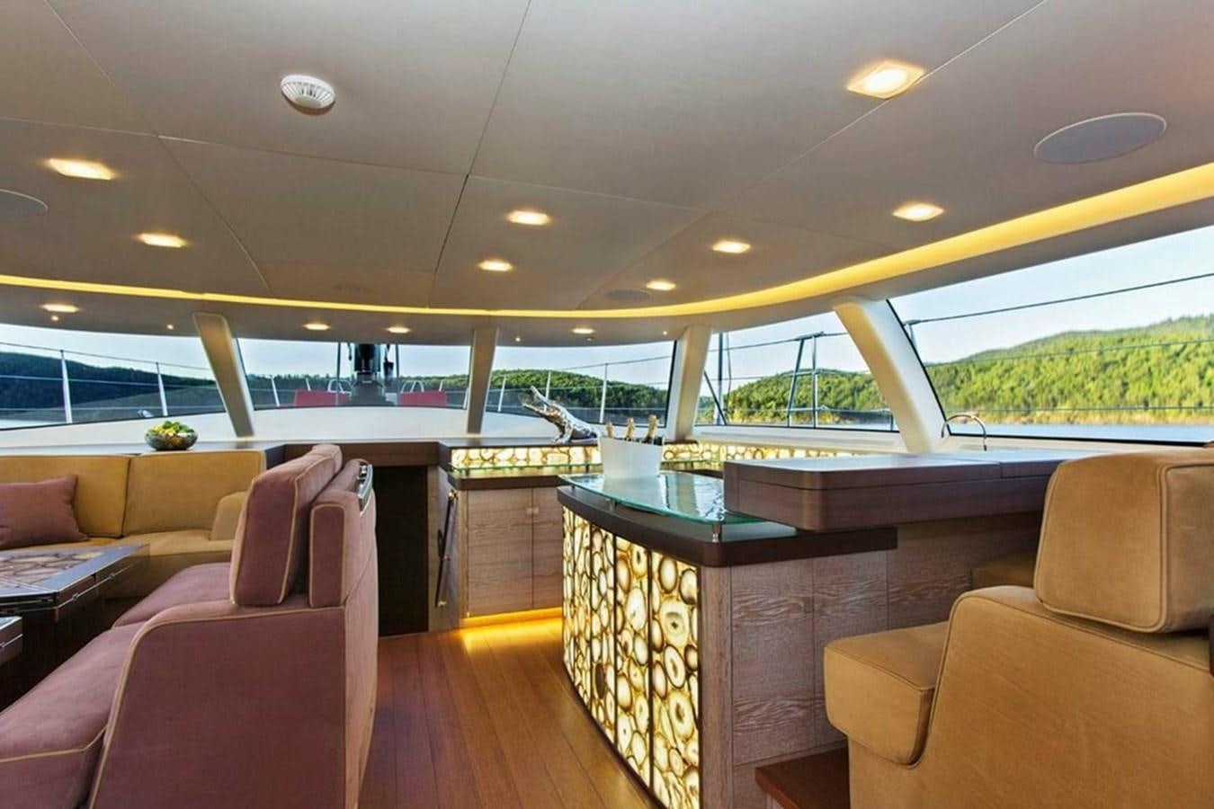 a room with a table and chairs aboard ESCAPADE Yacht for Sale