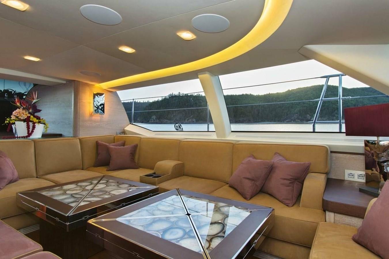 a living room with a large glass window aboard ESCAPADE Yacht for Sale