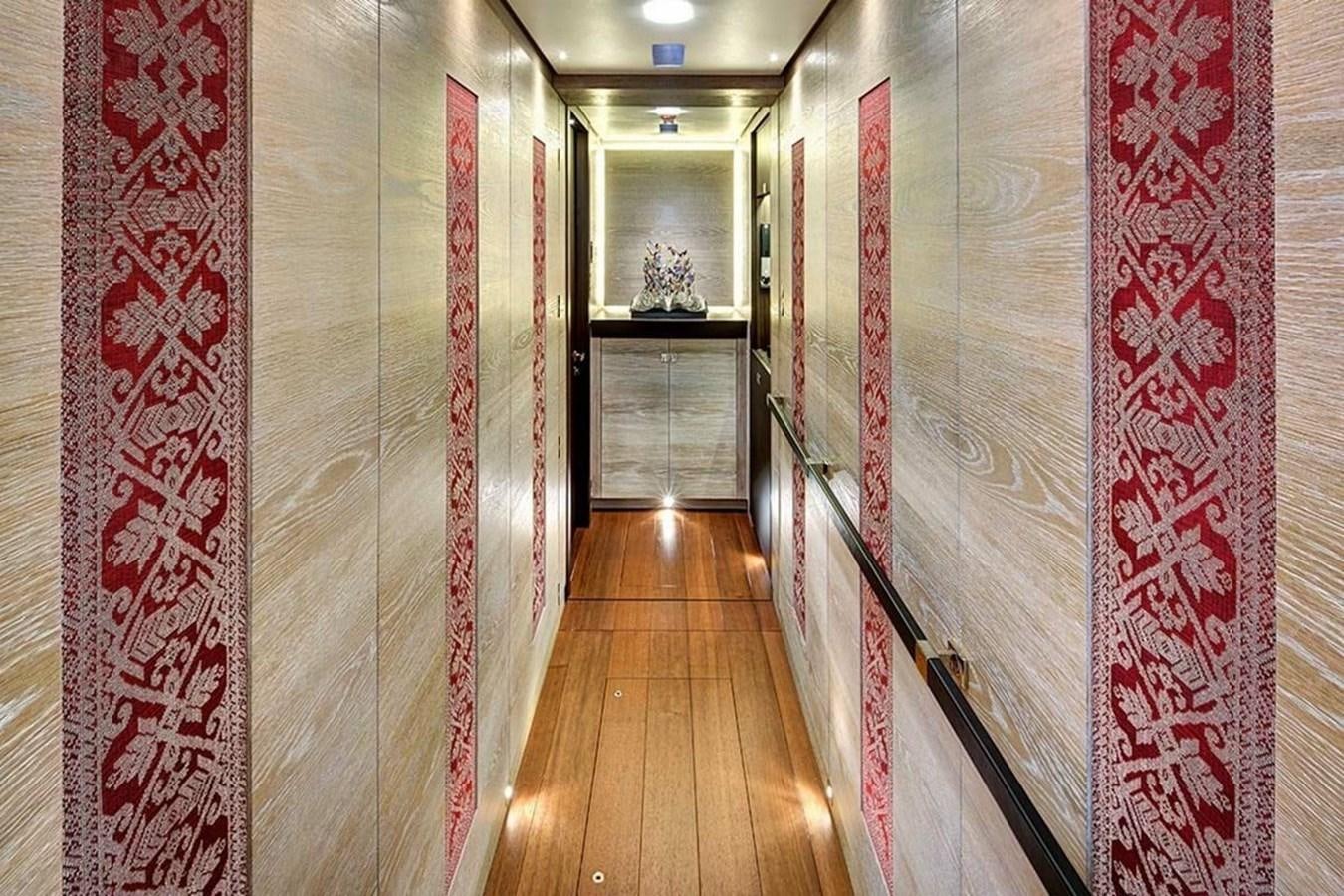 a hallway with a wood floor aboard ESCAPADE Yacht for Sale