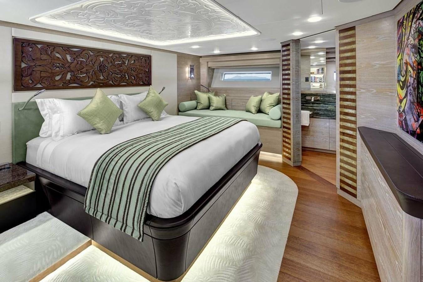 a room with a bed and a couch aboard ESCAPADE Yacht for Sale