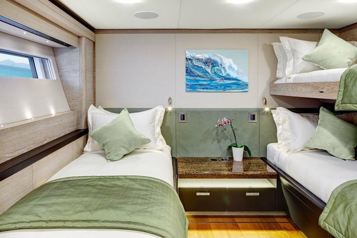 a couple of beds in a room aboard ESCAPADE Yacht for Sale