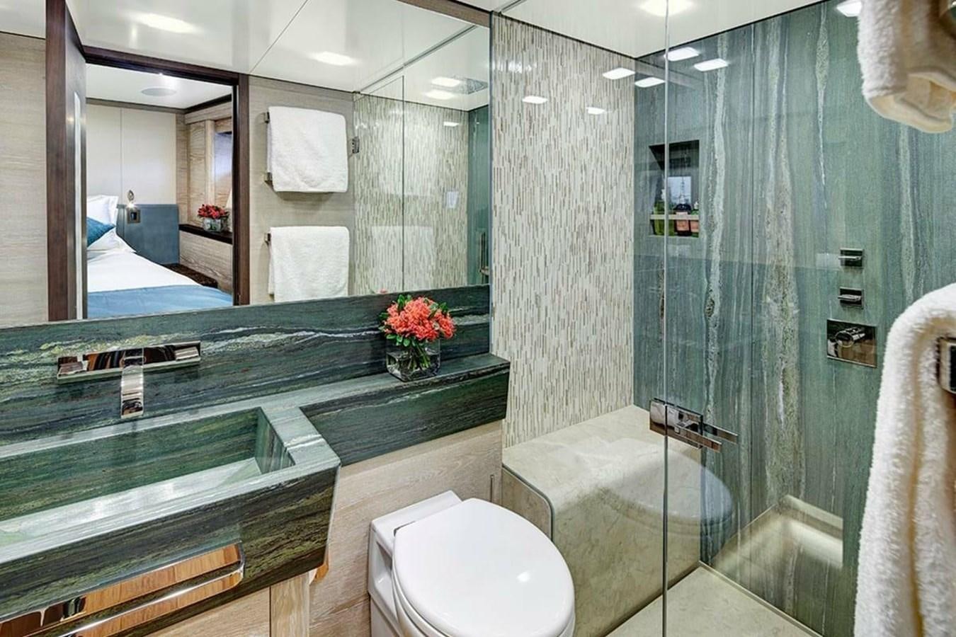 a bathroom with a glass shower aboard ESCAPADE Yacht for Sale