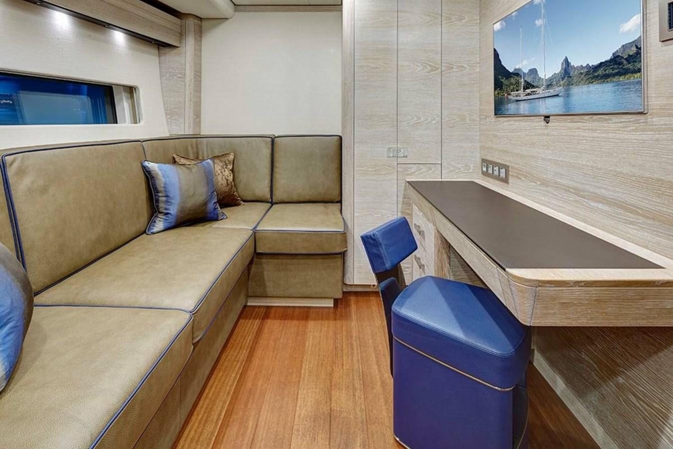a living room with a couch and a table aboard ESCAPADE Yacht for Sale