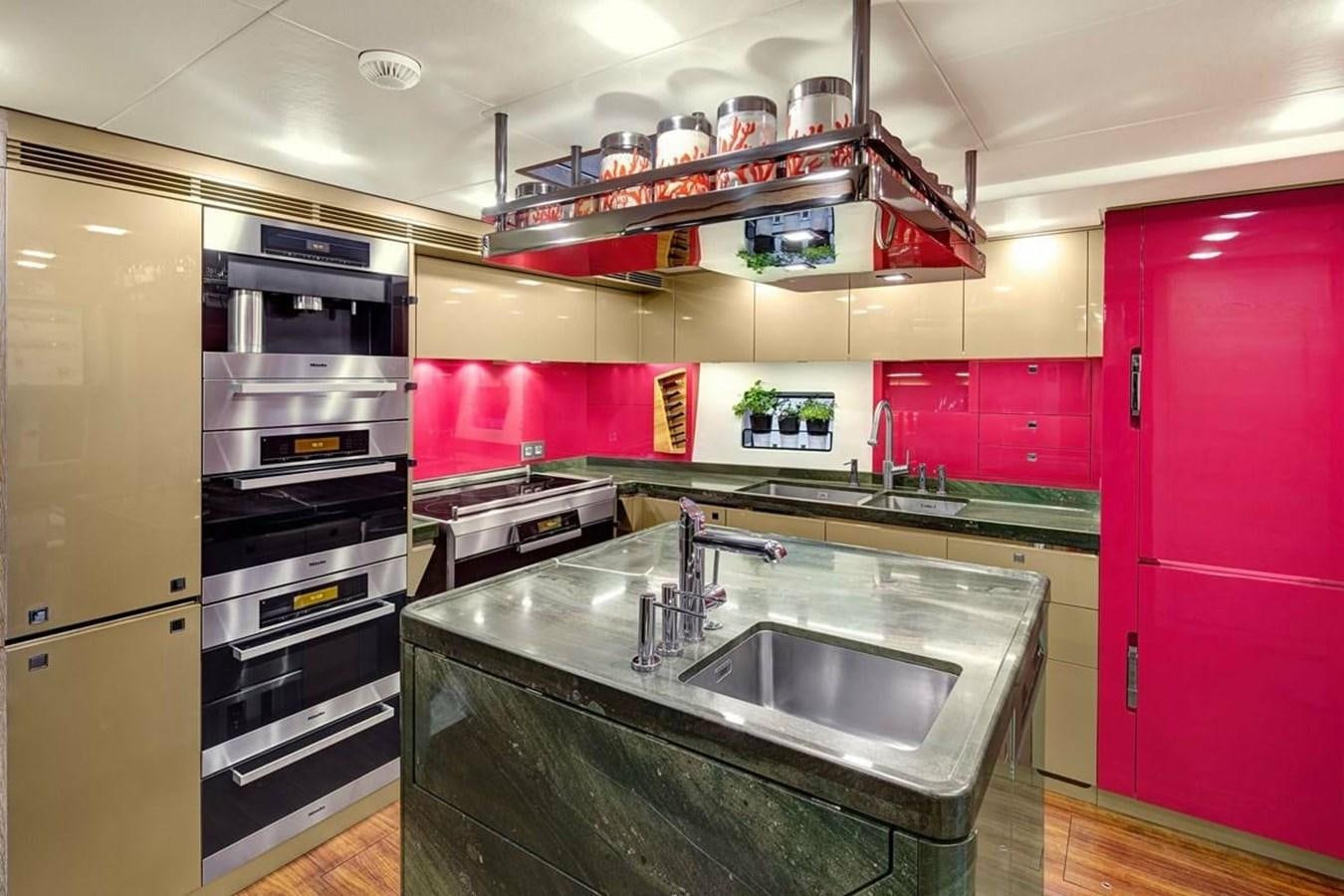 a kitchen with a sink and stove aboard ESCAPADE Yacht for Sale