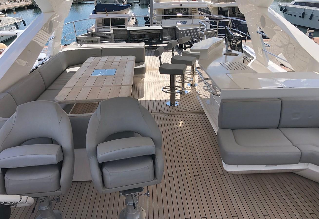 a room with a row of seats aboard TICKETYBOO Yacht for Sale