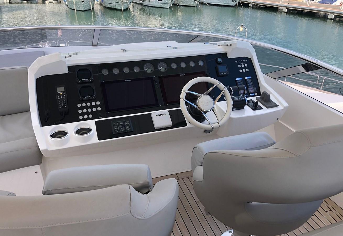 a boat with a steering wheel aboard TICKETYBOO Yacht for Sale