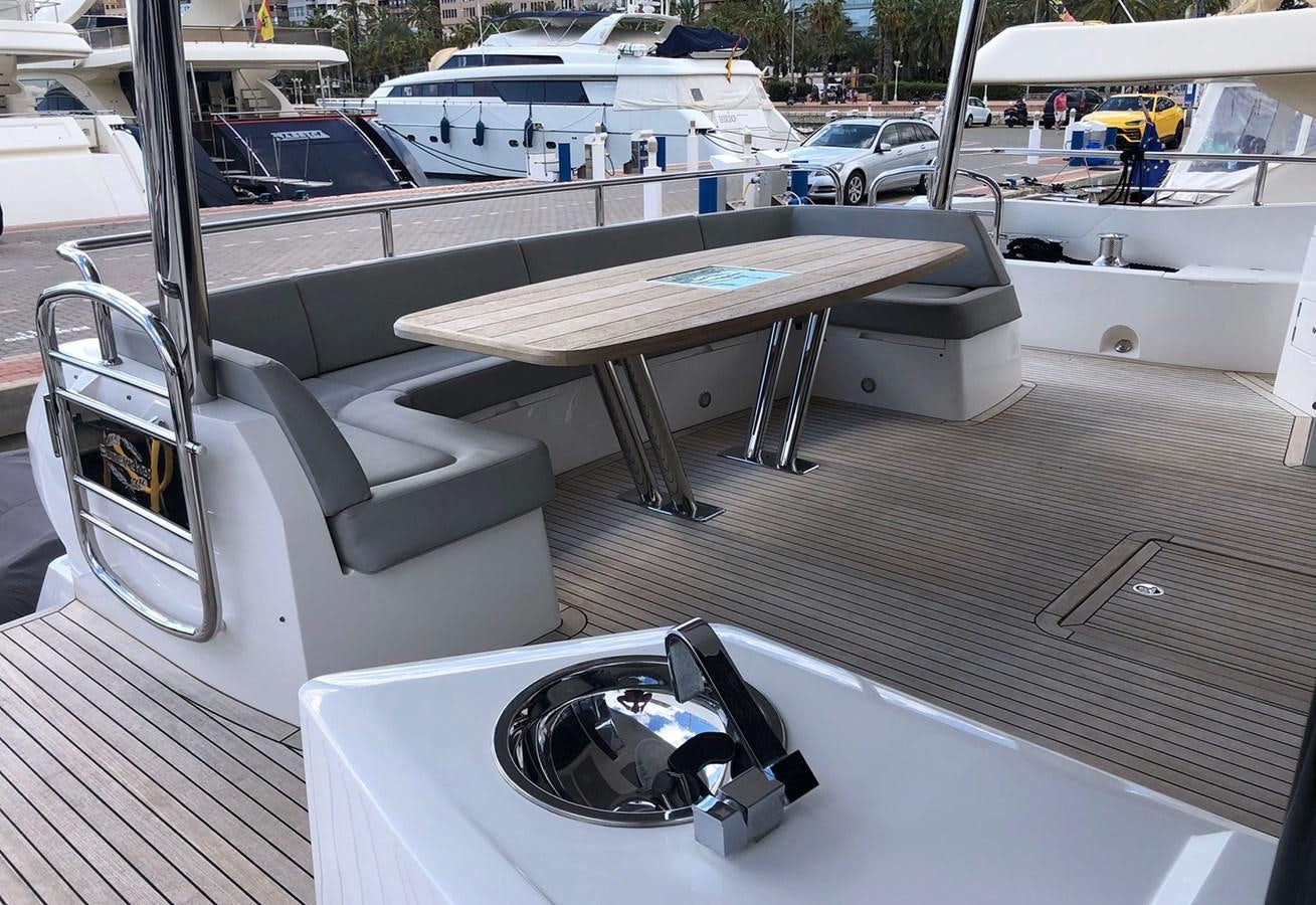 a table and a camera on a boat aboard TICKETYBOO Yacht for Sale