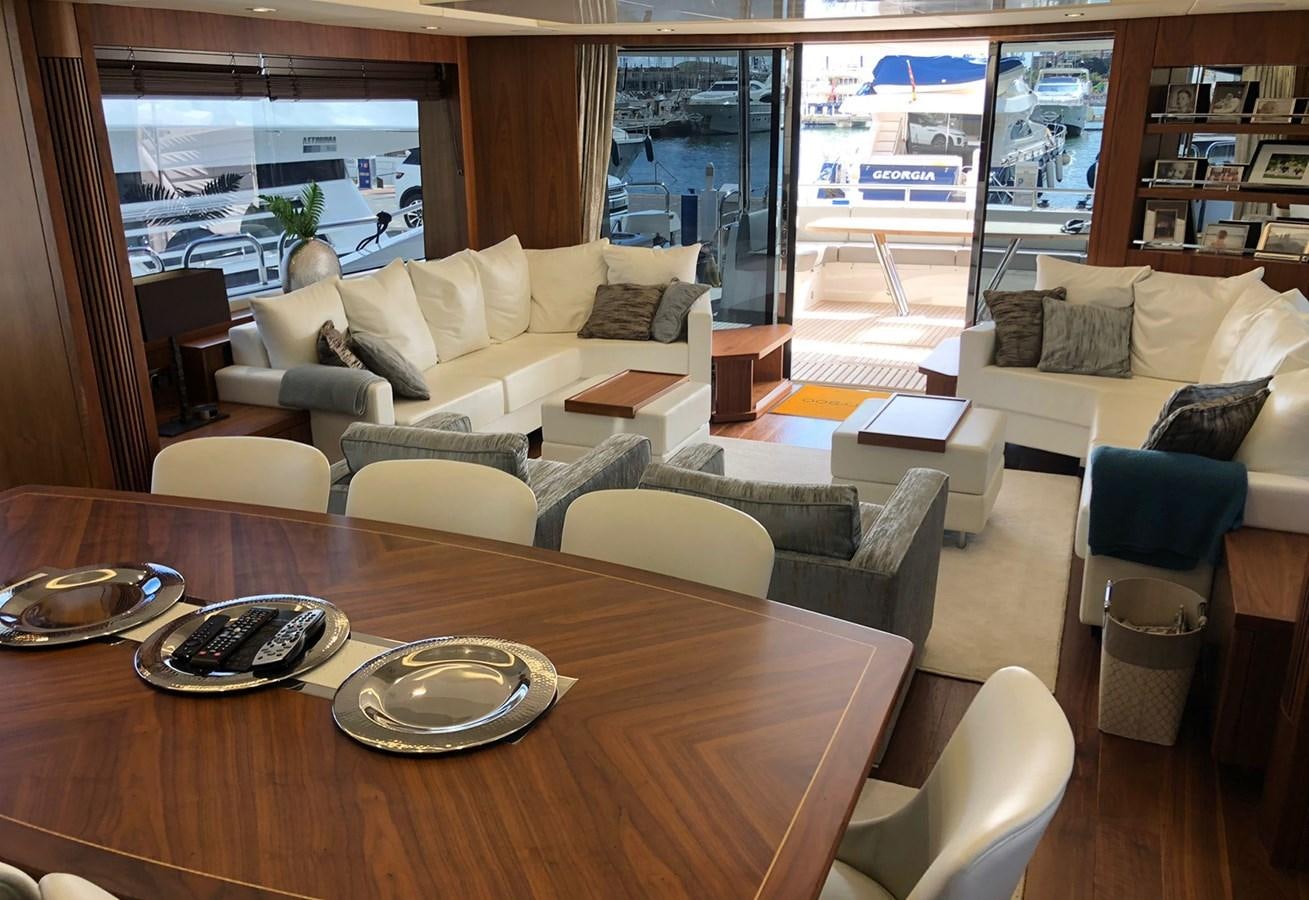 a living room with a table and chairs aboard TICKETYBOO Yacht for Sale