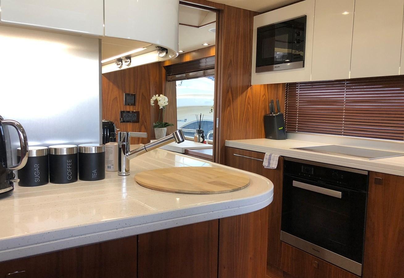 a kitchen with a sink and a window aboard TICKETYBOO Yacht for Sale