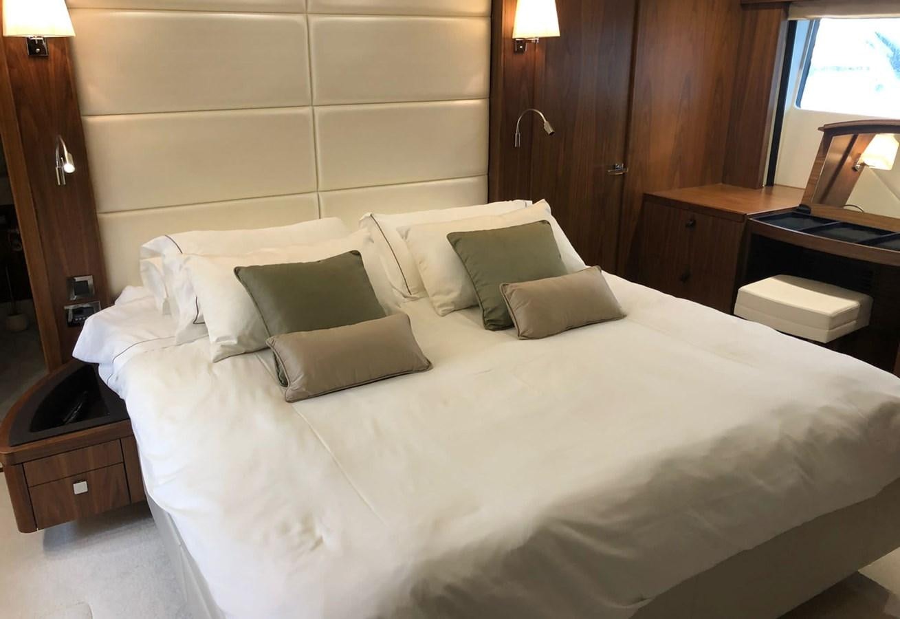 a bed with white sheets aboard TICKETYBOO Yacht for Sale