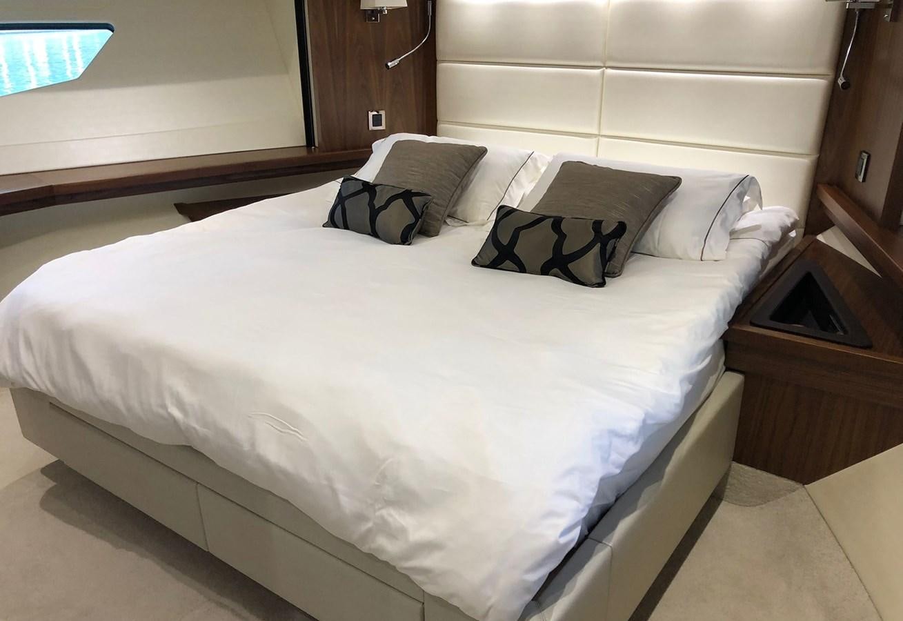 a bed with white sheets aboard TICKETYBOO Yacht for Sale