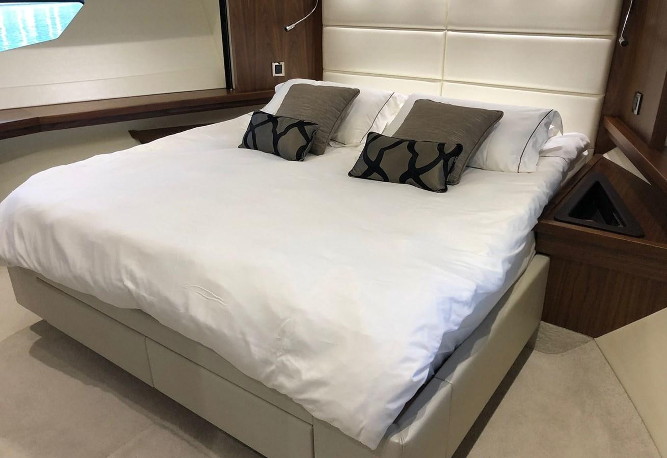 a bed with white sheets aboard TICKETYBOO Yacht for Sale