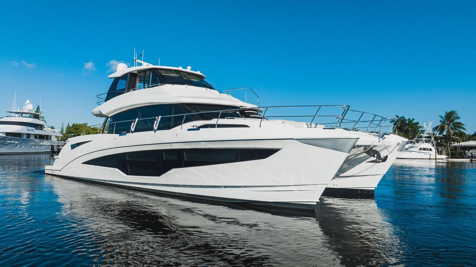 a white yacht in the water aboard PLANE TO SEA Yacht for Sale