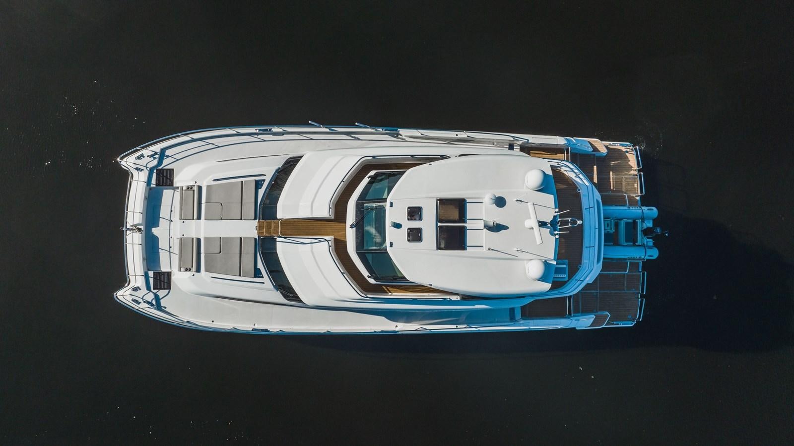 a model of a boat aboard PLANE TO SEA Yacht for Sale