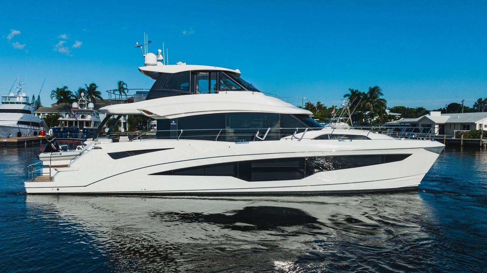 a white yacht in the water aboard PLANE TO SEA Yacht for Sale