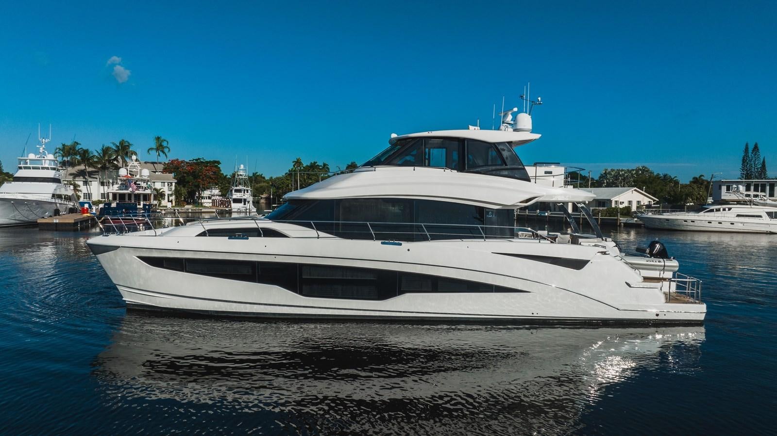 a white yacht in the water aboard PLANE TO SEA Yacht for Sale