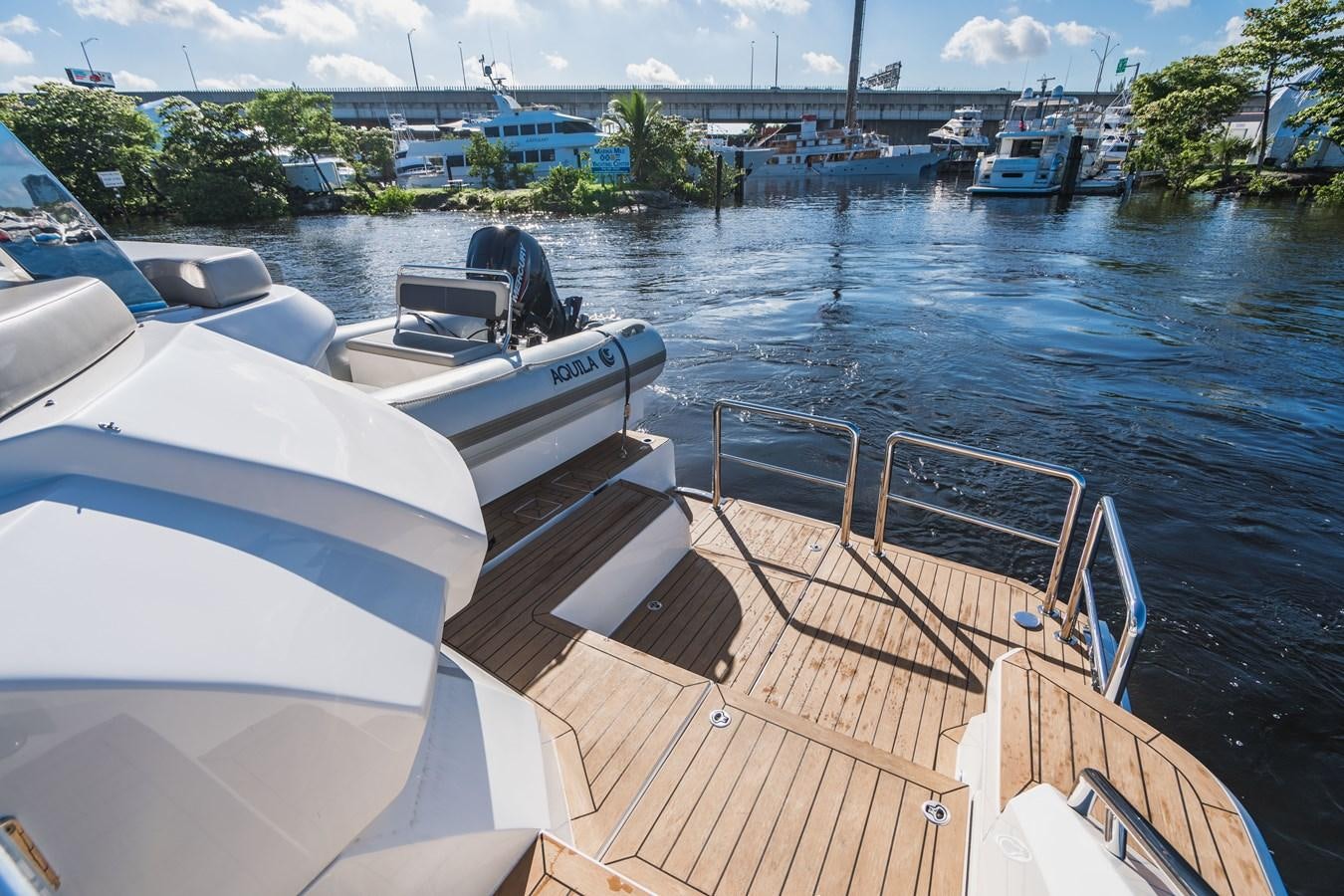 a boat is parked on the side of a river aboard PLANE TO SEA Yacht for Sale