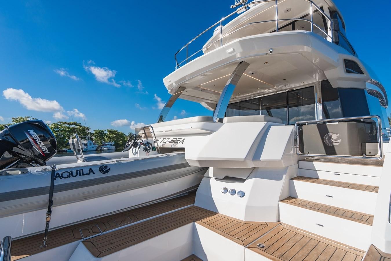 a group of boats docked aboard PLANE TO SEA Yacht for Sale