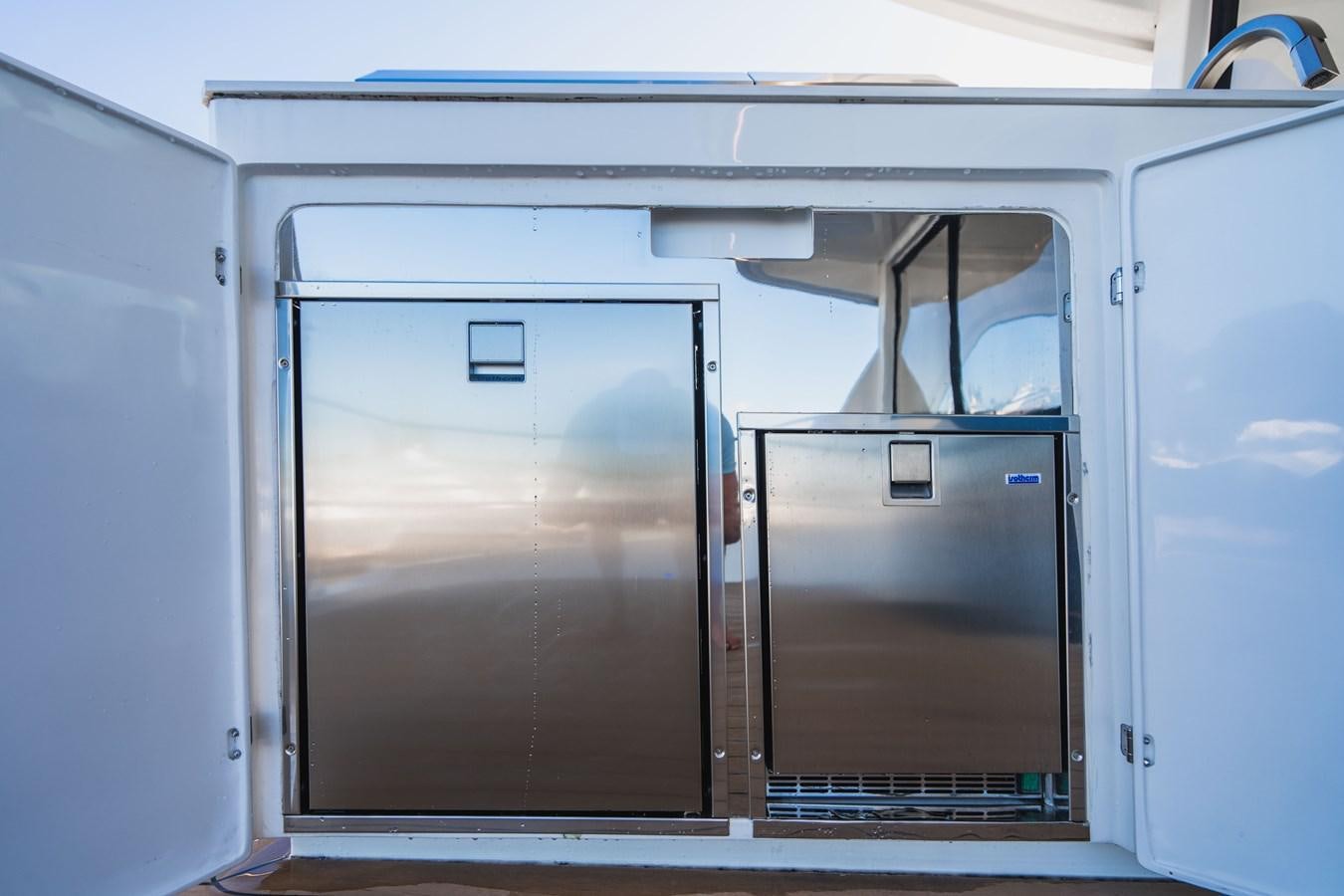 a couple of large metal containers aboard PLANE TO SEA Yacht for Sale