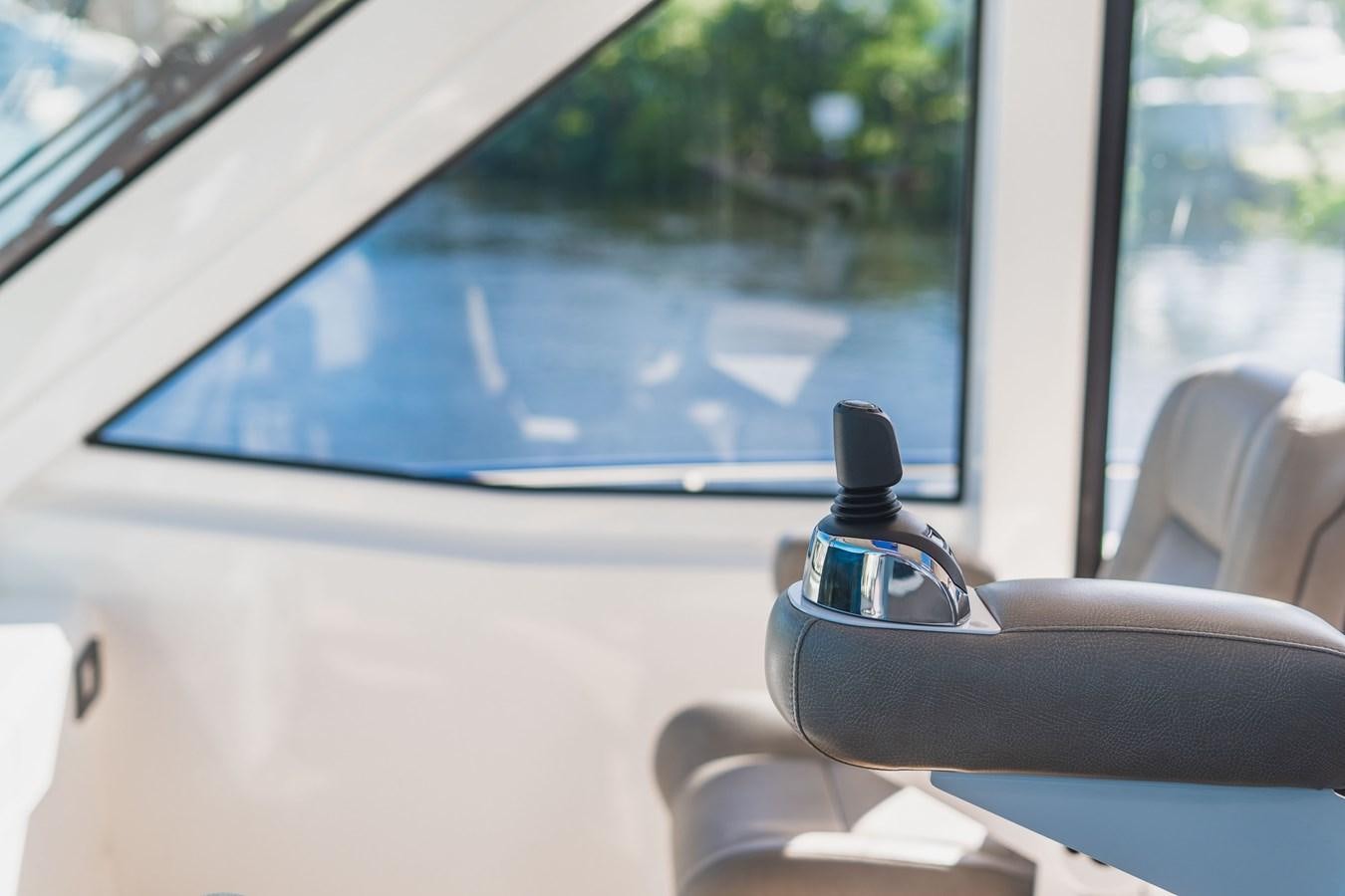 a car with a seat and a steering wheel and a window aboard PLANE TO SEA Yacht for Sale